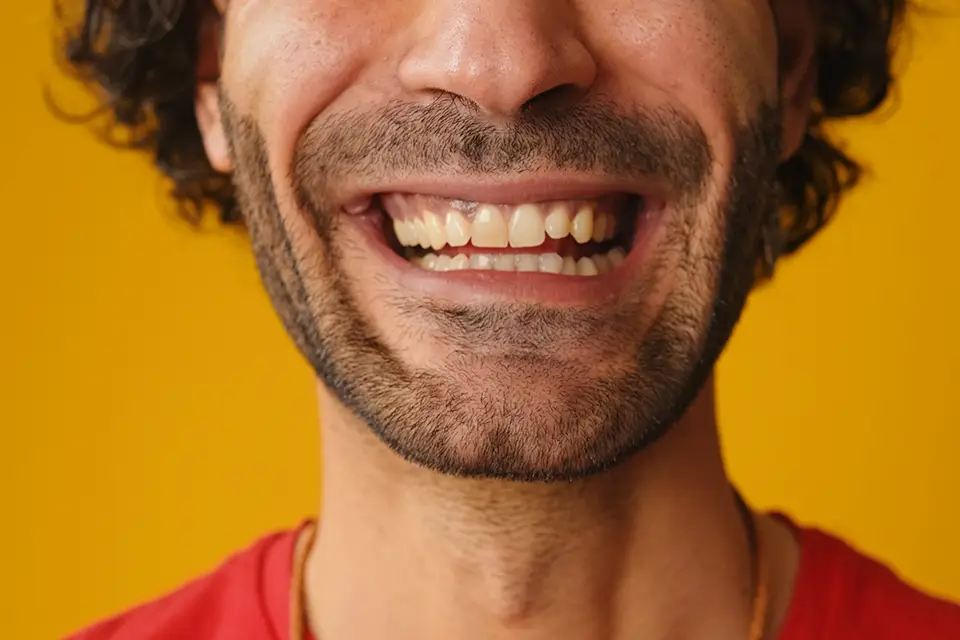 Why Do I Have One Tooth Darker Than the Others? Causes & Fixes