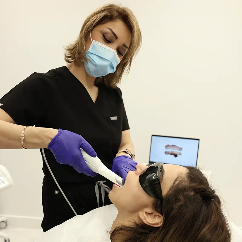 A dental chair with a dental instrument on top at Sunshine Dentistry