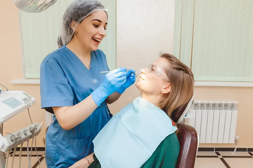 a-positive-dark-haired-woman-sits-in-the-dentist a-positive-dark-haired-woman-sits-in-the-dentist