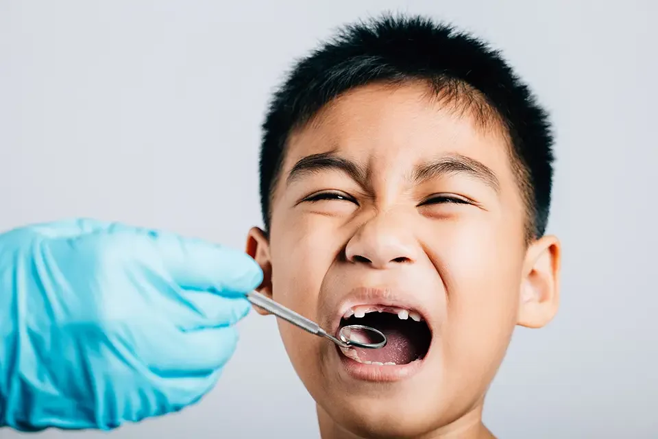 after-removing-a-child-s-loose-milk-tooth Preventing Emergency Dental Situations Before They Happen