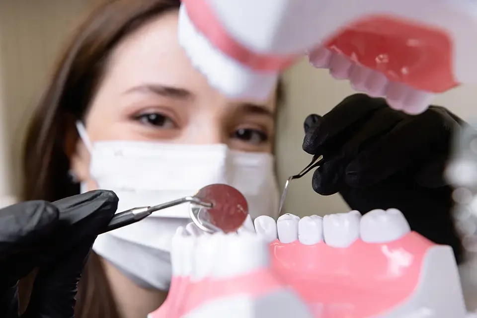 beautiful-woman-doctor-with-dental-equipment Average Gum Implant Cost