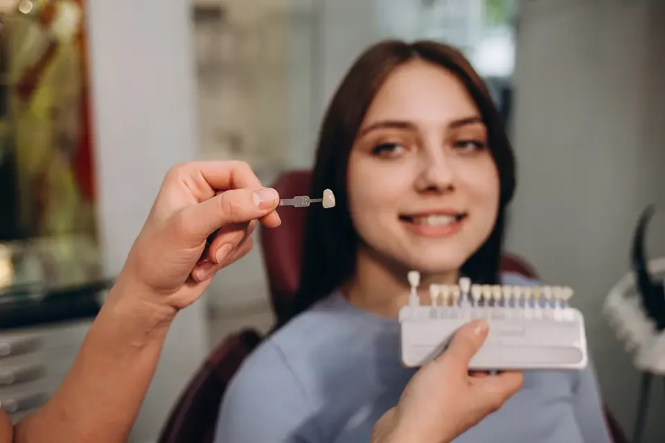 beautiful-woman-patient-having-dental-treatment Dental Plates vs. Implants: Key Differences