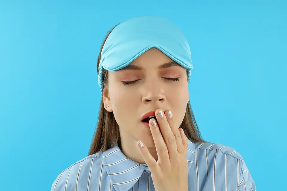 concept-of-people-young-woman-on-blue-background Treatment Options for Grinding Teeth in Sleep