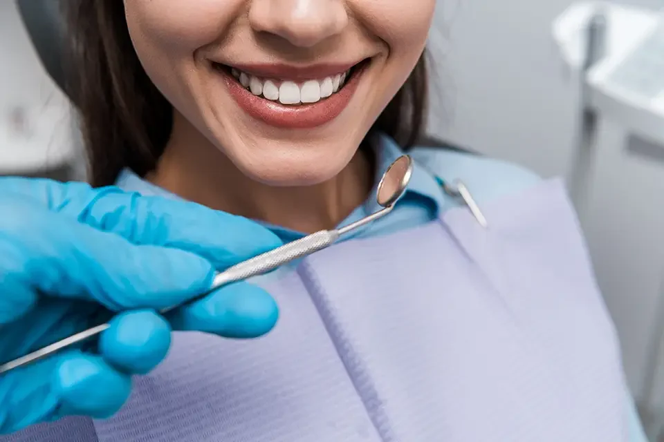 cropped-view-of-dentist-in-blue-latex-glove Average Cost of Teeth Capping in Richmond Hill
