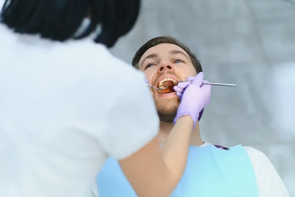 dental-care-concept-handsome-young-guy-at-the-dentist What Happens During an Annual Dental Check-Up?