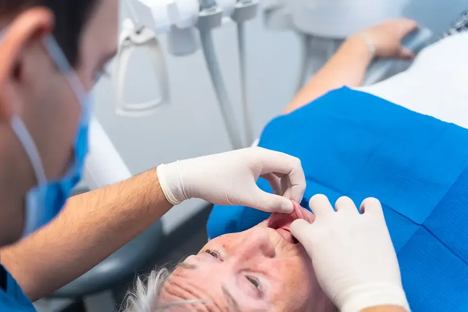 dental-clinic-detail-of-the-hands-of-a-doctor Treatment for an Infected Root Canal