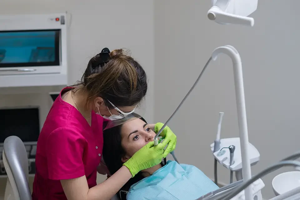 dentist-cleaning-teeth-of-woman Emergency Dental Care Options in Bayview Richmond Hill