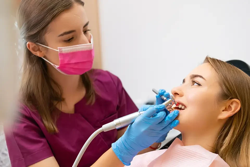 dentist-doing-a-dental-treatment-on-a-woman The Importance of Professional Dental Cleaning