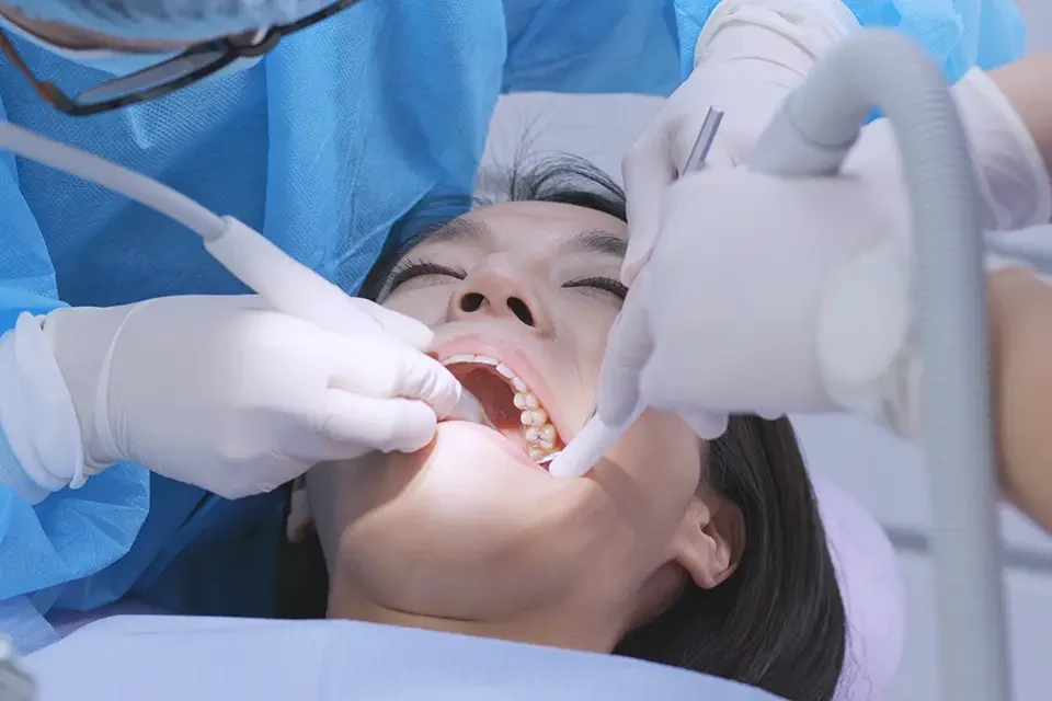 dentist-examines-the-patient-teeth Average Cost of a Molar Root Canal