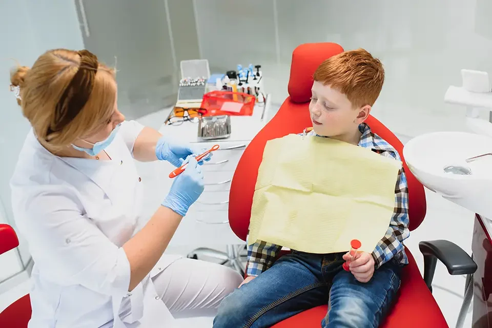 female-dentist-and-child-in-a-dentist-office The Right Dentist for a Child on the Autism Spectrum