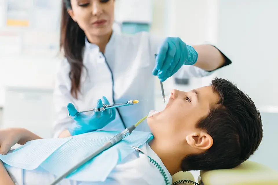 injection-of-anesthesia-boy-in-dental-chair Benefits of Choosing an Anesthetic Dentist
