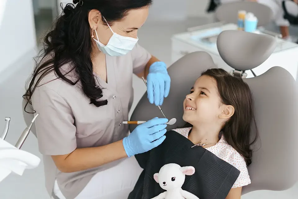 little-beautiful-girl-at-the-dentist-smiling Qualities of the Best Pediatric Dentist Near You