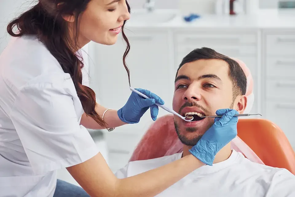man-visiting-dentist-in-clinic Tips for Finding a Cheap Dentist Near You