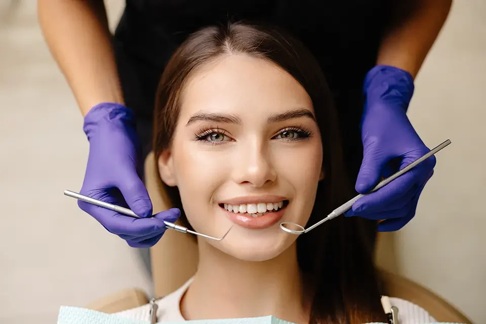 octor-is-checking-teeth-using-a-dental-instrument The Integrated Approach: Building Lifelong Oral Wellness, Step by Step