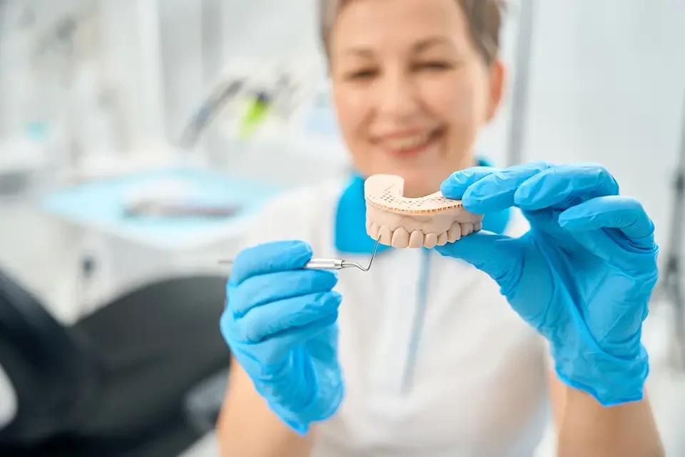 woman-dental-and-aesthetic-practitioner Average Cost of Bridge Dentures