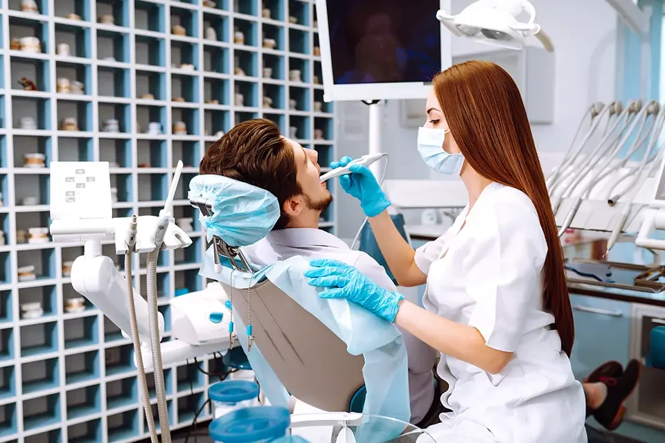 young-man-at-the-dentist-s-chair-during-a-dental-procedure What to Expect During a Dental Check-Up Appointment