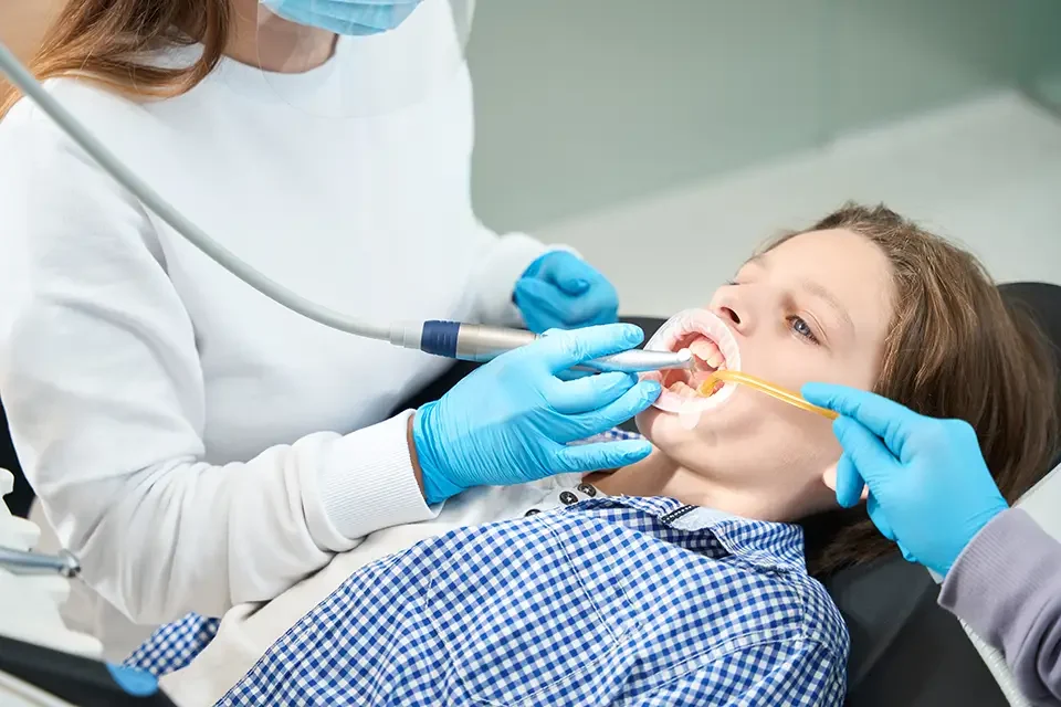 young-patient-treats-tooth-at-a-dentist-in-medical-office The Tooth Sealant Application Process